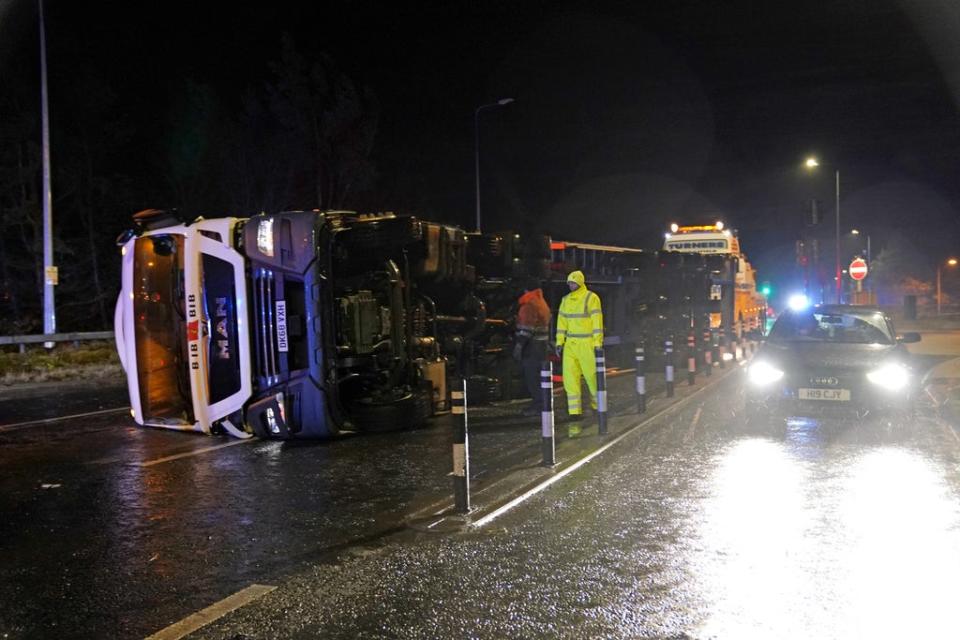 A lorry blown over in high winds blocks the A179 near Hartlepool, County Durham (Owen Humphreys/PA) (PA Wire)