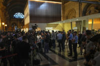 Lawyers and trial goers gather outside the special court room after the verdict in Paris Wednesday, June 29, 2022. The lone survivor of a team of Islamic State extremists was convicted Wednesday of murder and other charges and sentenced to life in prison without parole in the 2015 bombings and shootings across Paris that killed 130 people in the deadliest peacetime attacks in French history. (AP Photo/Michel Euler)