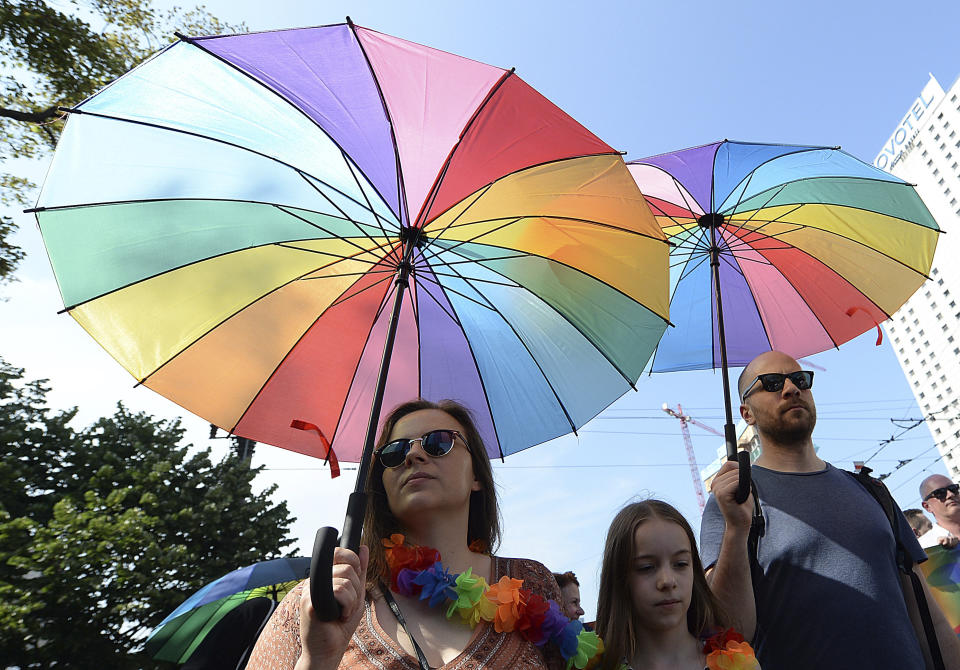 People take part in a gay pride parade in Warsaw, Poland, Saturday, June 8, 2019. The Equality Parade is the largest gay pride parade in central and Eastern Europe. It brought thousands of people to the streets of Warsaw at a time when the LGBT rights movement in Poland is targeted by hate speeches and a government campaign depicting it as a threat to families and society. (AP Photo/Czarek Sokolowski)