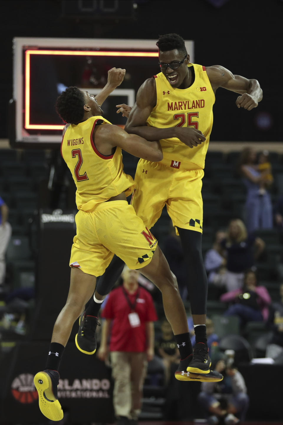 Maryland forwards Jalen Smith (25) and Makhel Mitchell (22) celebrate after defeating Marquette in an NCAA college basketball game Sunday, Dec. 1, 2019, in Lake Buena Vista, Fla. (AP Photo/Scott Audette)