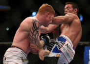 Jake Shields kicks Ed Herman during their middleweight bout at UFC 150 inside Pepsi Center on August 11, 2012 in Denver, Colorado. (Photo by Josh Hedges/Zuffa LLC/Zuffa LLC via Getty Images)