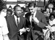 <p>Reporters interview the Rev. Martin Luther King, Jr., after a circuit court issued an injunction restricting civil rights marches in Chicago, Aug. 20, 1966. King labeled the action “unjust, illegal and unconstitutional.” (AP Photo/Larry Stoddard) </p>