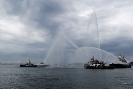 FILE PHOTO: Tug boats spray water during the 100th anniversary of the first test of a lockage through the Gatun Locks on the Atlantic side of the Panama Canal, on the outskirt of Colon City September 26, 2013. REUTERS/Carlos Jasso/File Photo