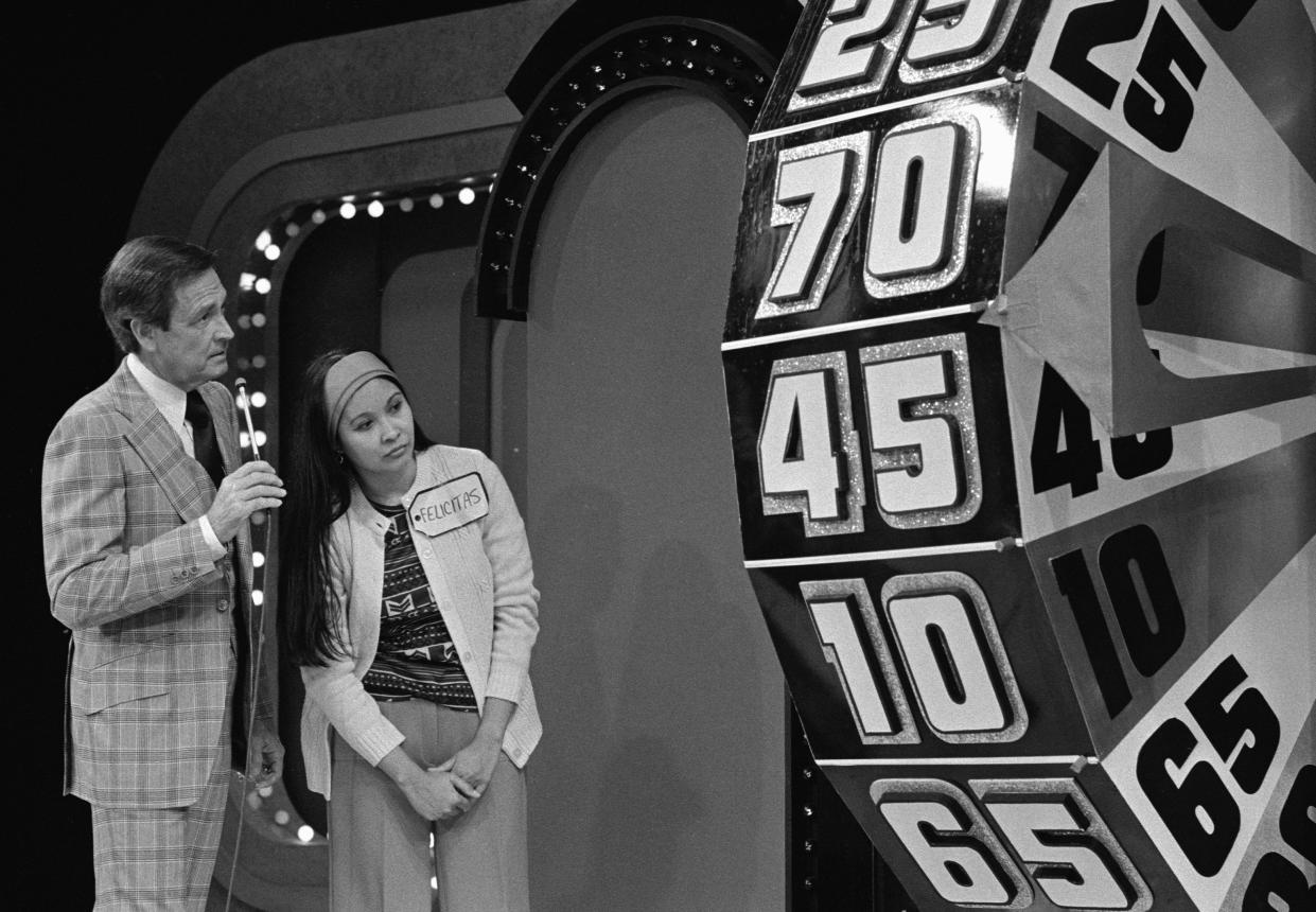 Bob Barker with a contestent named Felicitas on 'The Price Is Right', February 1978. (CBS Photo Archive/Getty Images)