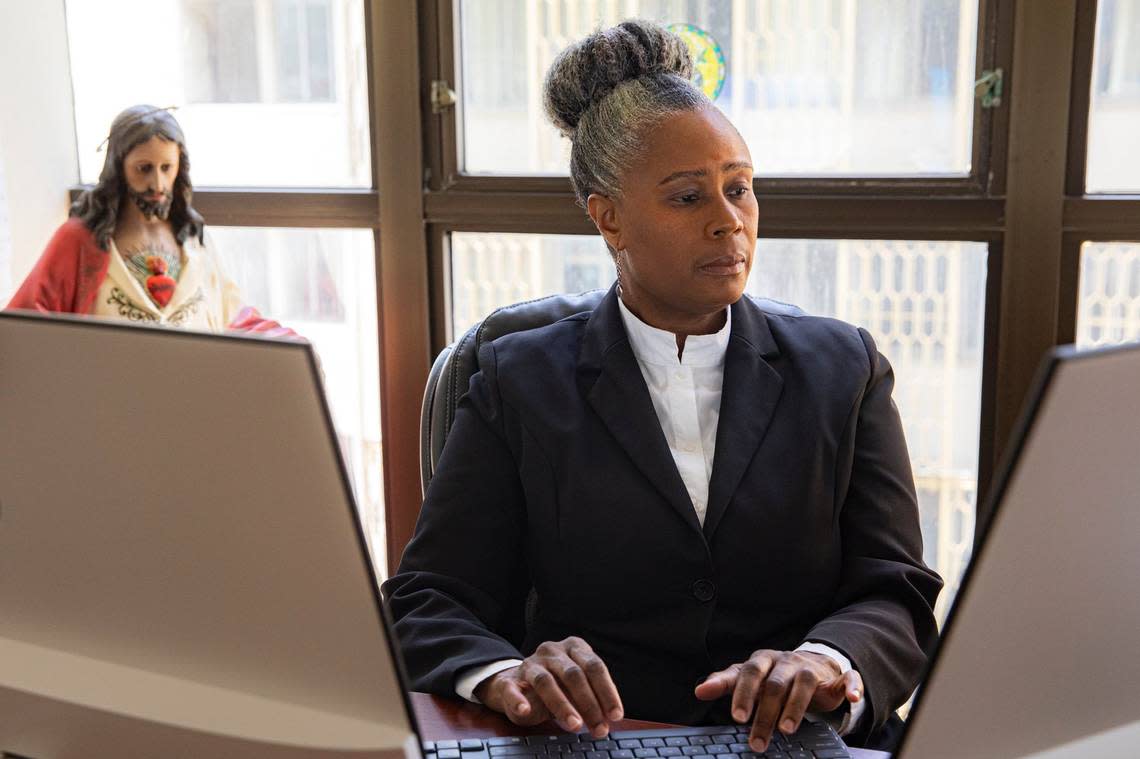 Myriam Mezadieu, Chief Operating Officer of Catholic Charities Legal Services, Archdiocese of Miami, Inc. (CCLS) working at the Courthouse Plaza Building in Miami.