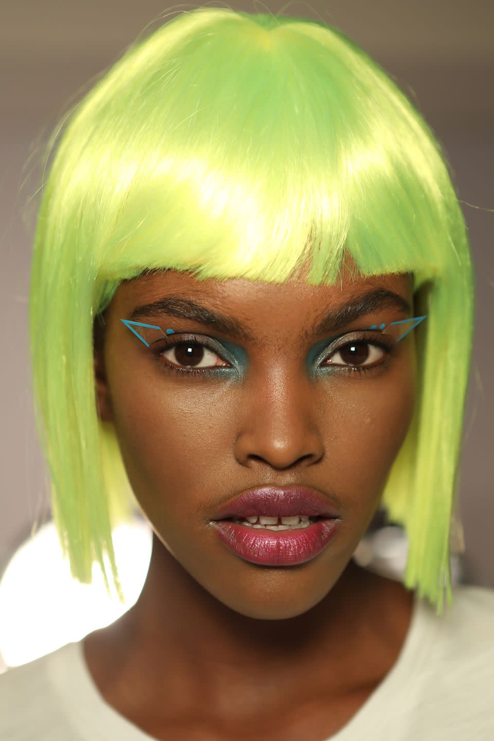 <p><strong>Trend: graphic eyeliner</strong><br></p><p>Like the neon wigs, styled by the hair stylist Eugene Souleiman, the make-up at Jeremy Scott was slightly out-of-this-world, with geometric eyeliner - an elevation of last season's <a rel="nofollow noopener" href="https://www.harpersbazaar.com/uk/beauty/make-up-nails/news/a38095/threes-a-trend-deconstructed-liner/" target="_blank" data-ylk="slk:deconstructed eyeliner trend;elm:context_link;itc:0;sec:content-canvas" class="link ">deconstructed eyeliner trend</a> - and overdrawn plumped lips. The products used for the look were from <a rel="nofollow noopener" href="https://www.maccosmetics.com/collections-mac-jeremy-scott" target="_blank" data-ylk="slk:Jeremy Scott's collaboration with Mac;elm:context_link;itc:0;sec:content-canvas" class="link ">Jeremy Scott's collaboration with Mac</a>, with the addition of plastic wire and Mac's <a rel="nofollow noopener" href="https://www.maccosmetics.co.uk/product/13848/9614/products/makeup/face/multi-use/acrylic-paint#/shade/Primary_Yellow" target="_blank" data-ylk="slk:Acrylic Paint;elm:context_link;itc:0;sec:content-canvas" class="link ">Acrylic Paint</a>, £16.50, to create the 3D eyeliner "wings".</p>