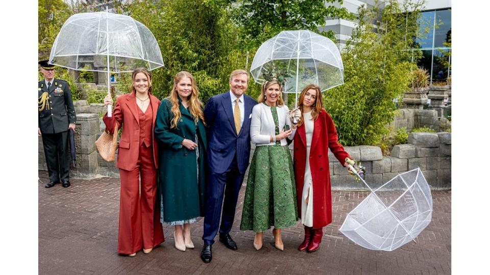 Princess Ariane with Crown Princess Catharina-Amalia, King Willem-Alexander, Queen Maxima and Princess Alexia with umbrellas