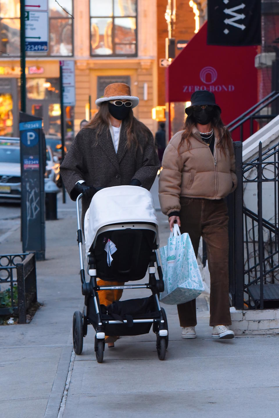 The model (left) takes her daughter for a walk around New York's SoHo with a friend.  (Getty Images)