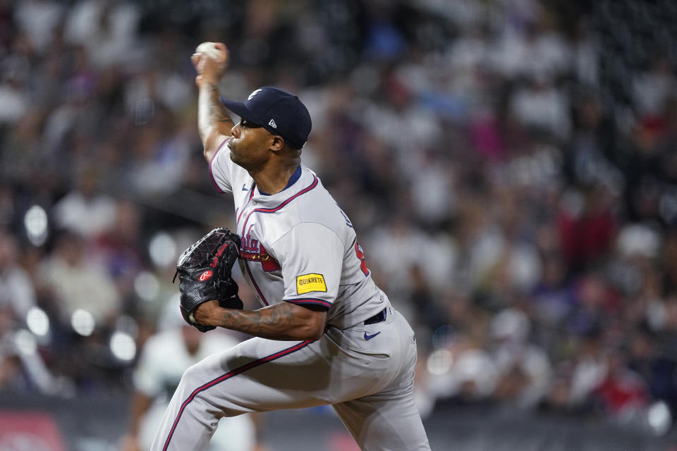 Atlanta Braves pitcher Raisel Iglesias works against the Colorado Rockies in the ninth inning of a baseball game Saturday, Aug. 10, 2024, in Denver. (AP Photo/David Zalubowski)