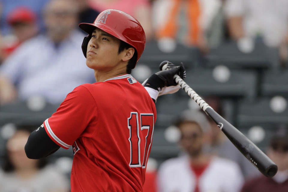 FILE - In this Feb. 28, 2020, file photo, Los Angeles Angels' Shohei Ohtani bats during the first inning of a spring training baseball game against the Texas Rangers, in Tempe, Ariz. (AP Photo/Charlie Riedel, File)