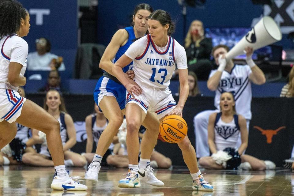 Kansas Jayhawks guard Holly Kersgieter (13) dribbles in the first half of a Big 12 Tournament women’s basketball game against the BYU Cougars at T-Mobile Center on Friday, March 8, 2024, in Kansas City. Emily Curiel/ecuriel@kcstar.com