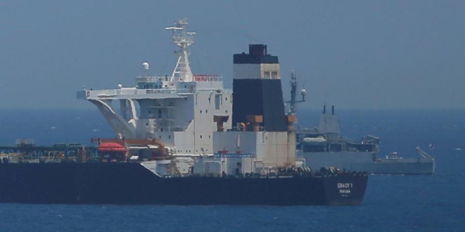 FILE PHOTO: A British Royal Navy patrol vessel guards the oil supertanker Grace 1, that's on suspicion of carrying Iranian crude oil to Syria, as it sits anchored in waters of the British overseas territory of Gibraltar, July 4, 2019. REUTERS/Jon Nazca/