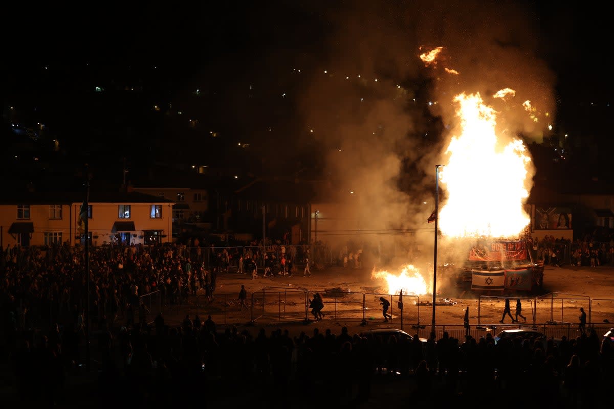 People gather at a nationalist bonfire in Londonderry (Liam McBurney/PA) (PA Wire)