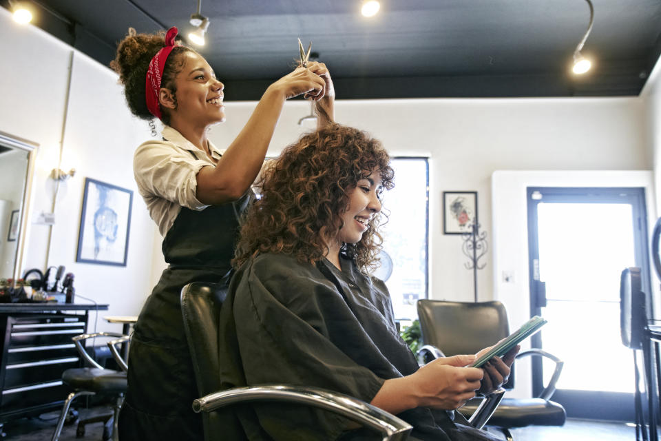 hairdresser working on a client's hair