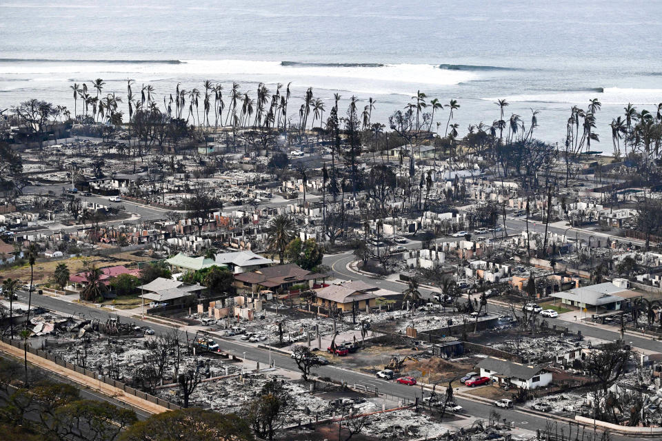 An aerial image taken on August 10, 2023 shows destroyed homes and buildings burned to the ground in Lahaina in the aftermath of wildfires in western Maui, Hawaii. At least 36 people have died after a fast-moving wildfire turned Lahaina to ashes, officials said August 9, 2023 as visitors asked to leave the island of Maui found themselves stranded at the airport. The fires began burning early August 8, scorching thousands of acres and putting homes, businesses and 35,000 lives at risk on Maui, the Hawaii Emergency Management Agency said in a statement.  (Patrick T. Fallon / AFP - Getty Images)