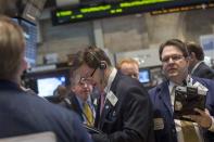 Traders work on the floor of the New York Stock Exchange March 19, 2014. REUTERS/Brendan McDermid