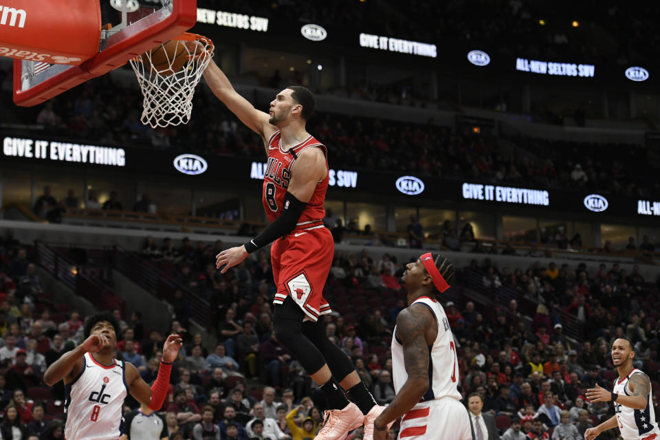 Chicago Bulls' Zach La Vine (8) dunks during the second half of an NBA basketball game against the Washington Wizards Sunday, Feb. 23, 2020, in Chicago. Chicago won 126-117. (AP Photo/Paul Beaty)