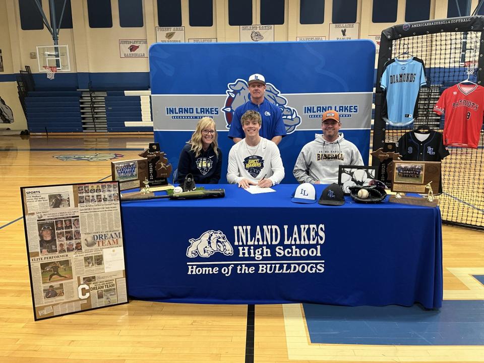 With family and coaches present, Inland Lakes senior baseball star Connor Wallace officially signed to continue his career at Grand Rapids Community College next season.