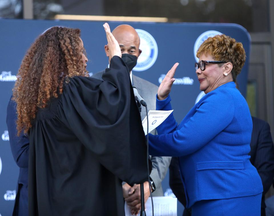 Cynthia Chestnut, right, takes the oath of office during the Gainesville City Commission swearing-in ceremony at City Hall on Feb. 17, 2022. [Brad McClenny/The Gainesville Sun]
(Credit: Brad McClenny/The Gainesville Sun)
