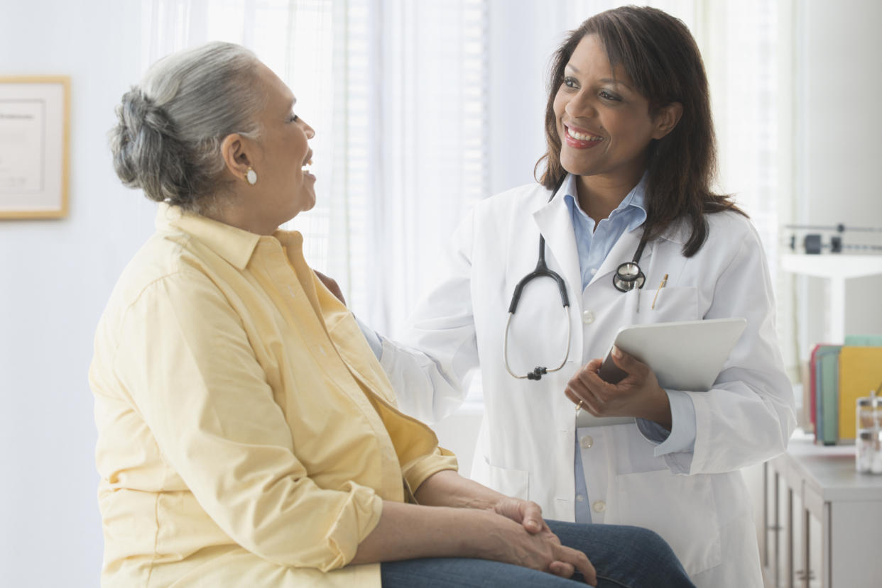 Female physicians with female patient