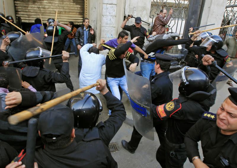 FILE PHOTO: Riot police clash with protesters in Cairo