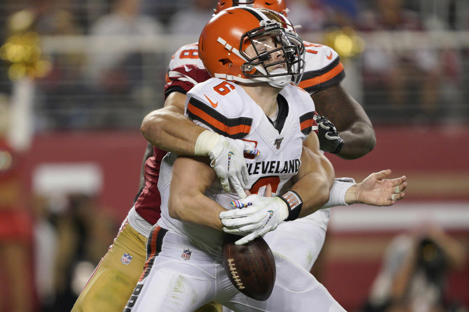 San Francisco 49ers defensive end Nick Bosa, center, sacks and forces a fumble by Cleveland Browns quarterback Baker Mayfield (6) during the second half of an NFL football game in Santa Clara, Calif., Monday, Oct. 7, 2019. The Browns recovered the ball. (AP Photo/Tony Avelar)