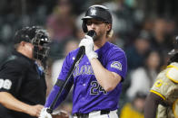 Colorado Rockies' Ryan McMahon (24) reacts after striking out against San Diego Padres relief pitcher Dylan Cease in the seventh inning of a baseball game Monday, April 22, 2024, in Denver. (AP Photo/David Zalubowski)