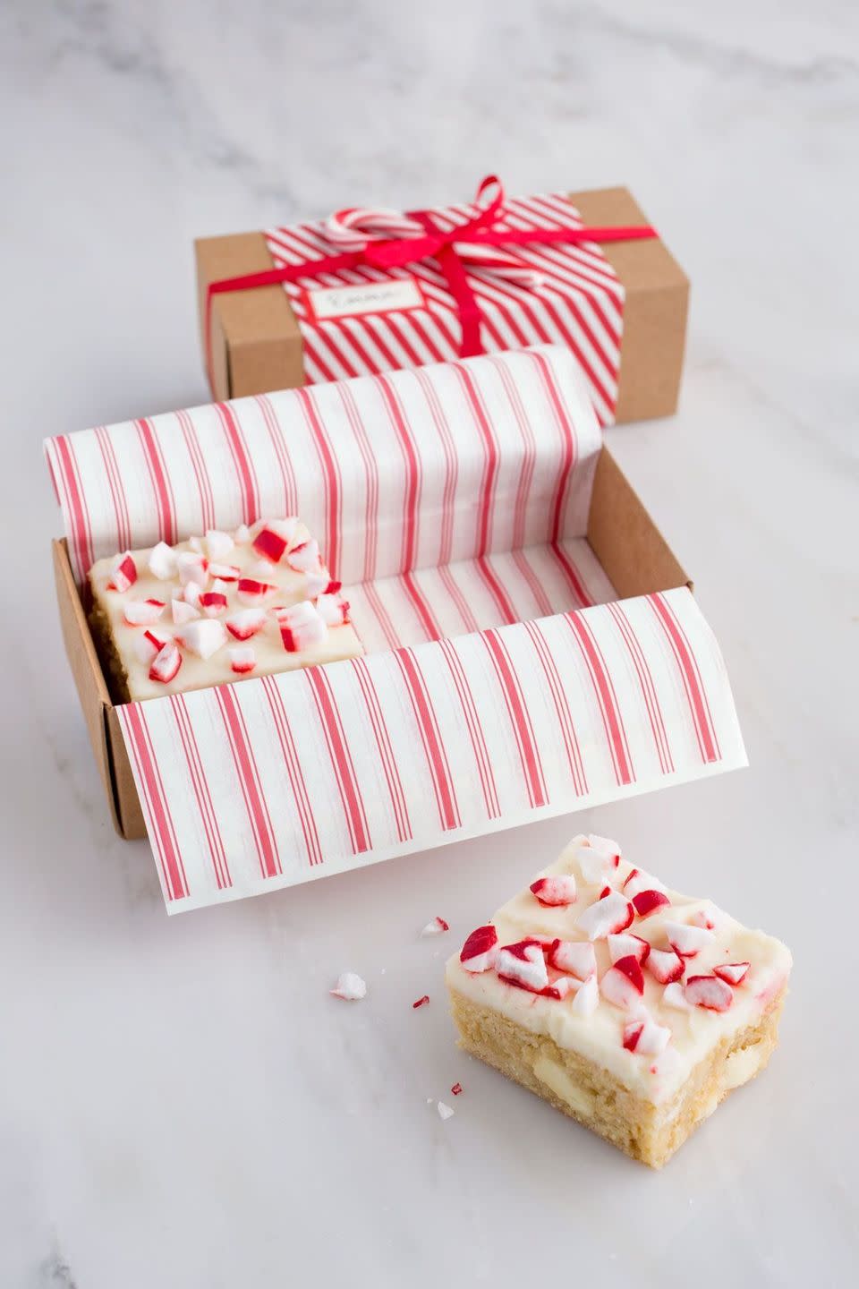 <p>These candy-cane flecked blondies are the perfect holiday treat for all your peppermint-loving friends. </p><p><strong><a href="https://www.countryliving.com/food-drinks/recipes/a36897/white-chocolate-peppermint-blondies/" rel="nofollow noopener" target="_blank" data-ylk="slk:Get the recipe for White Chocolate-and-Peppermint Blondies;elm:context_link;itc:0;sec:content-canvas" class="link ">Get the recipe for White Chocolate-and-Peppermint Blondies</a>. </strong></p>