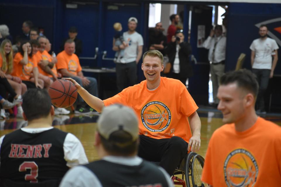 Syracuse University's Buddy Boeheim brings the ball up the court for the celebrity team during the 18th annual Sitrin Celebrity Wheelchair Classic at Utica University Thursday, April 28, 2022.