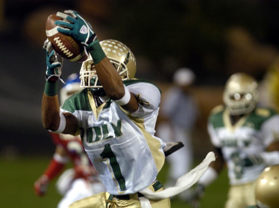 Long Beach Poly's DeSean Jackson intercepts a pass from Los Alamitos quarterback Jim Barnes.