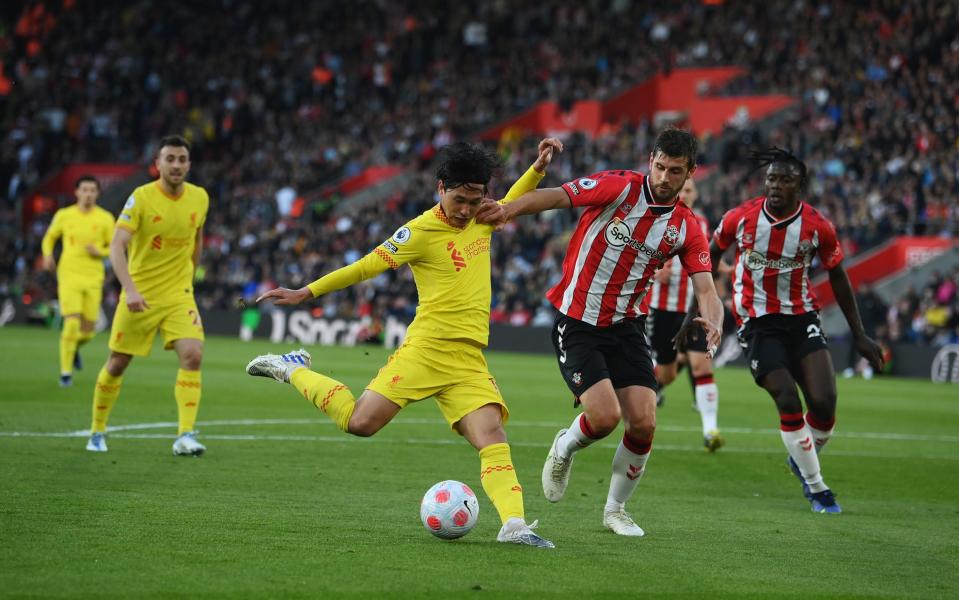 Takumi Minamino of Liverpool scores their sides first goal during the Premier League match between Southampton and Liverpool  - Mike Hewitt/Getty Images