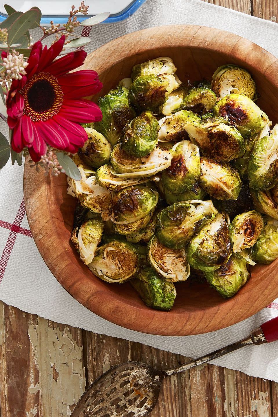 roasted brussels sprouts in a wooden serving bowl