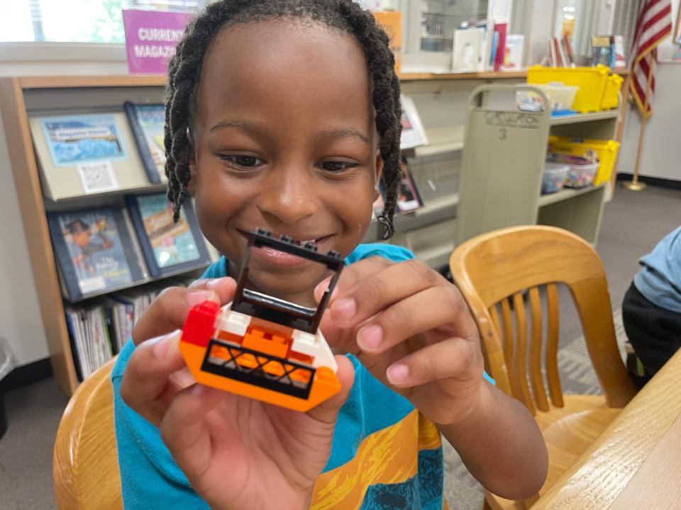 Ayvre Johnson, 6, is making a speedboat complete with moveable parts at the monthly LEGO Club at Karns Branch Library Saturday, May 21, 2022.