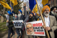 Bhupinder Singh, center, joins other Indian Sikhs in a march near the White House, Tuesday, Feb. 18, 2020, in Washington, to protest the Indian government's injustice against Sikhs in India ahead of President Donald Trump's visit to India. (AP Photo/Manuel Balce Ceneta)