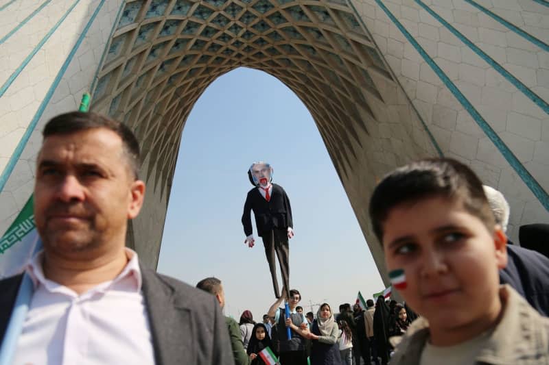 Iranian people hold up a maquette of Israeli Prime Minister Benjamin Netanyahu during a rally marking the 45th anniversary of the Islamic Revolution in Tehran. Rouzbeh Fouladi/ZUMA Press Wire/dpa