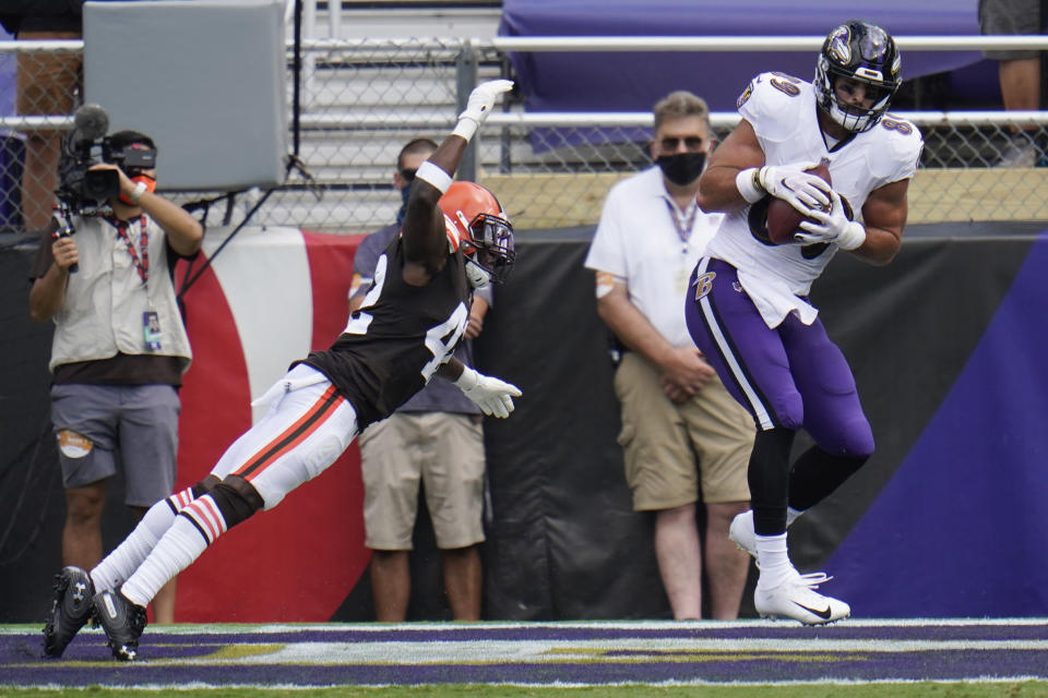 Baltimore Ravens tight end Mark Andrews (89) catches a touchdown as Cleveland Browns free safety Karl Joseph (42) attempts to tackle, during the first half of an NFL football game, Sunday, Sept. 13, 2020, in Baltimore, MD. (AP Photo/Julio Cortez)