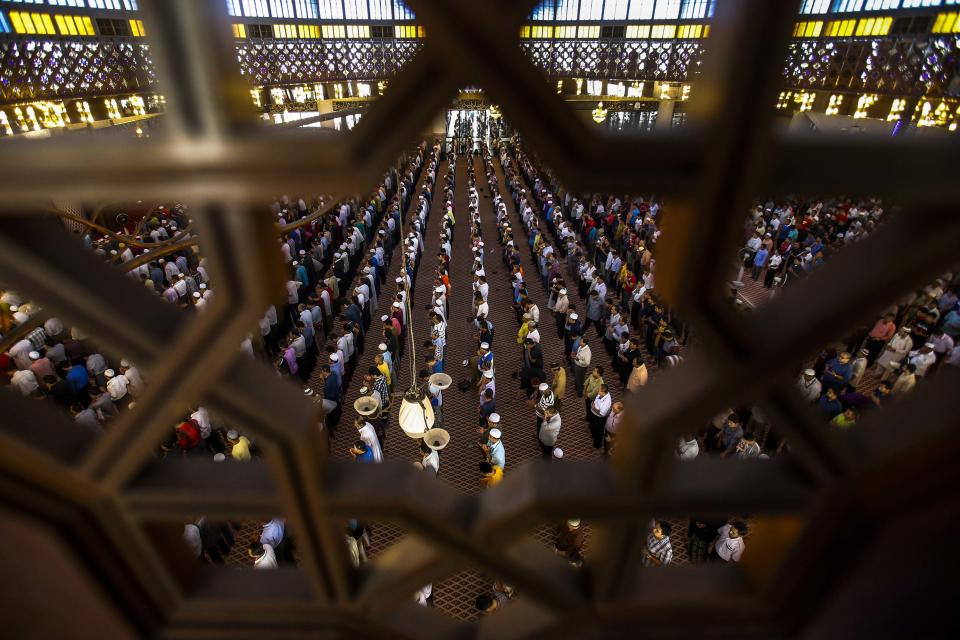 Muslims attend Friday prayers at the National Mosque in Kuala Lumpur