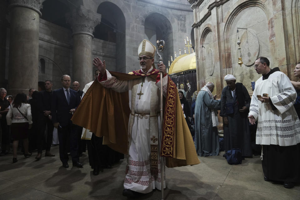 FILE - Latin Patriarch of Jerusalem Pierbattista Pizzaballa leads the Easter Sunday Mass at the Church of the Holy Sepulcher, where many Christians believe Jesus was crucified, buried and rose from the dead, in the Old City of Jerusalem, Sunday, April 9, 2023. Since the rise of Israel's most right-wing government in history, church leaders say the 2,000-year-old Christian community in Jerusalem has come under increasing attack, with an uptick in harassment of clergy and vandalism of religious properties. Several church leaders, including the head of the Roman Catholic Church in the region, told The Associated Press they fear that Prime Minister Benjamin Netanyahu's ultranationalist coalition has empowered extremists. (AP Photo/Mahmoud Illean, File)