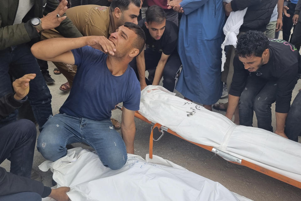 Mourners carry the bodies of members of the Abu Taha family who were killed in an Israeli airstrike, during their funeral at Al-Salam cemetery, east of Rafah, Gaza Strip. Monday, April 29, 2024. (AP Photo/Mohammad Jahjouh)