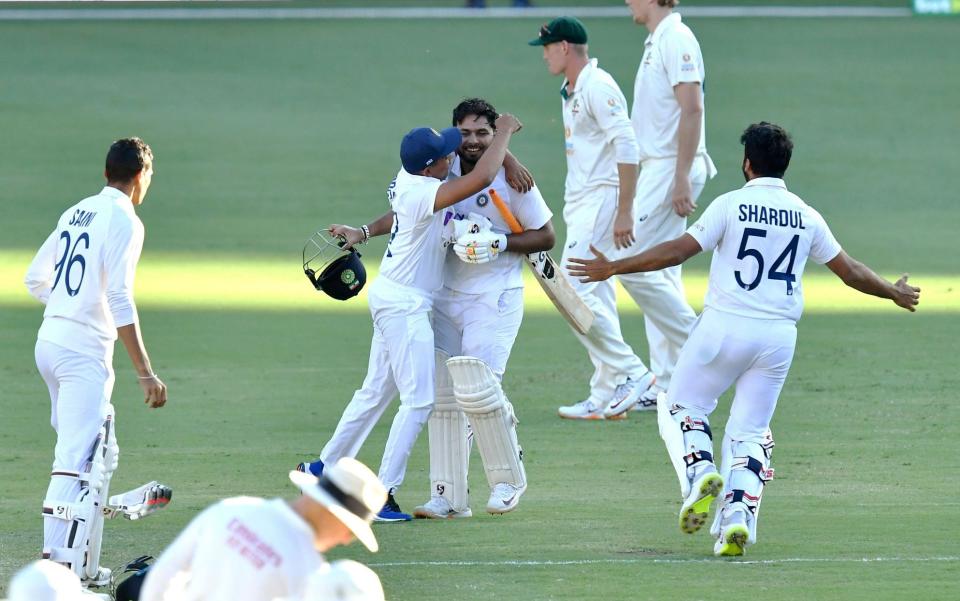 Rishabh Pant (C) of India celebrates with team mates after winning on day five of the fourth Test Match between Australia and India at the Gabba - SHUTTERSTOCK