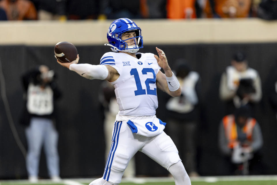 BYU quarterback Jake Retzlaff (12) passes the ball in the first half of an NCAA college football game against Oklahoma State Saturday, Nov. 25, 2023, in Stillwater, Okla. (AP Photo/Mitch Alcala)