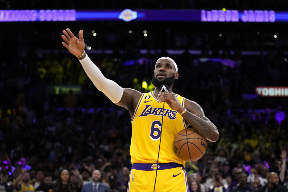 Los Angeles Lakers forward LeBron James speaks to fans after passing Kareem Abdul-Jabbar to become the NBA's all-time leading scorer during the second half of an NBA basketball game against the Oklahoma City Thunder Tuesday, Feb. 7, 2023, in Los Angeles. (AP Photo/Ashley Landis)