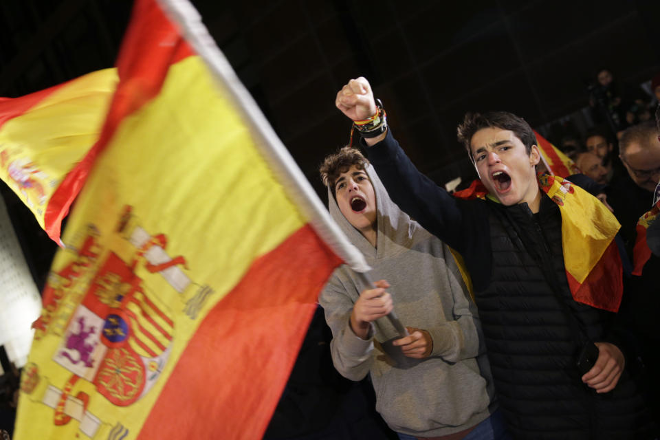 Spain's far-right Vox party supporters cheer outside the party headquarters after the announcement of the general election first results, in Madrid, Spain, Sunday, Nov. 10, 2019. Spain's Interior Ministry says that early results show Socialists winning Spain's national election, but without a clear end to the country's political deadlock. Vox is also surging to become the country's third political force, more than doubling its presence in the parliament's lower house from 24 to 53 deputies only six months after its debut. (AP Photo/Andrea Comas)