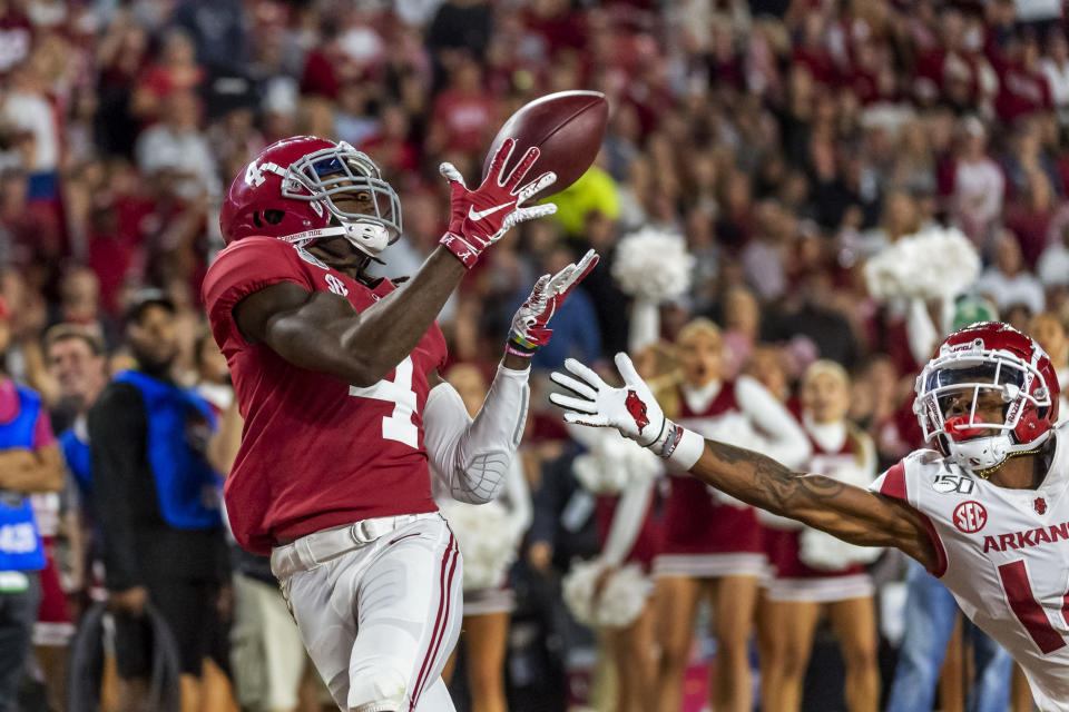 Alabama wide receiver Jerry Jeudy (4) catches a touchdown pass against Arkansas during the second half of an NCAA college football game, Saturday, Oct. 26, 2019, in Tuscaloosa, Ala. (AP Photo/Vasha Hunt)