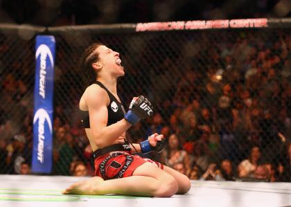 Joanna Jedrzejczyk celebrates her TKO win over Carla Esparza at UFC 185. (Getty)