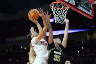 Maryland forward Mimi Collins (2) goes up for a shot against Purdue forward Rickie Woltman (35) during the first half of an NCAA college basketball game, Wednesday, Dec. 8, 2021, in College Park, Md. (AP Photo/Julio Cortez)