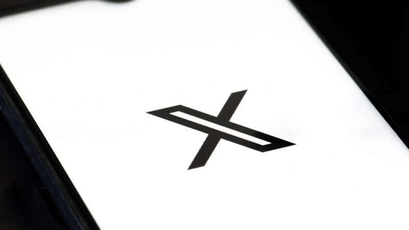 A smartphone screen with the logo for X (formerly Twitter).