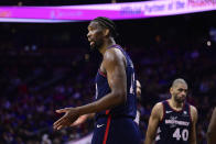 Philadelphia 76ers' Joel Embiid reacts to a call during the second half of an NBA basketball game against the Detroit Pistons, Tuesday, April 9, 2024, in Philadelphia. (AP Photo/Derik Hamilton)