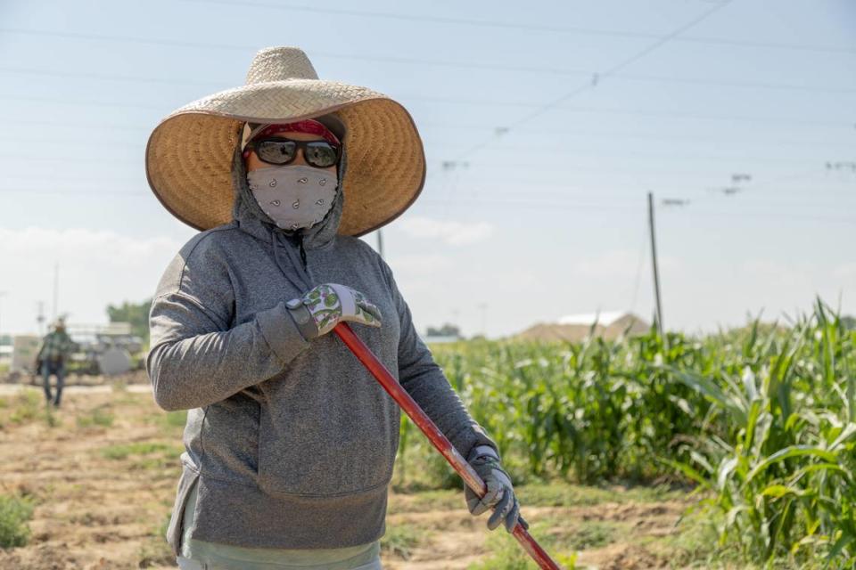 Libertad Sanchez, 46, keeping track of where the workers are and guiding other workers of lanes that need worked on. Daniel Ramirez