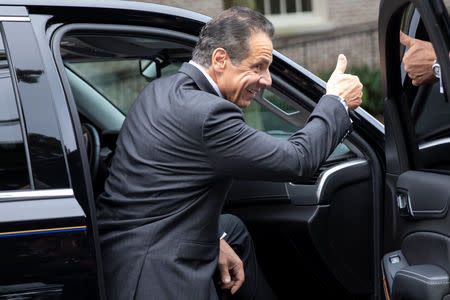 New York Governor Andrew Cuomo gestures as he gets into his car after voting in the New York Democratic primary election at the Presbyterian Church in Mt. Cisco, New York, U.S., September 13, 2018. REUTERS/Mike Segar